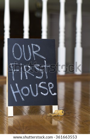 Our First House Sign With Keys In An Empty Home Our First House Sign With Keys In An Empty Home