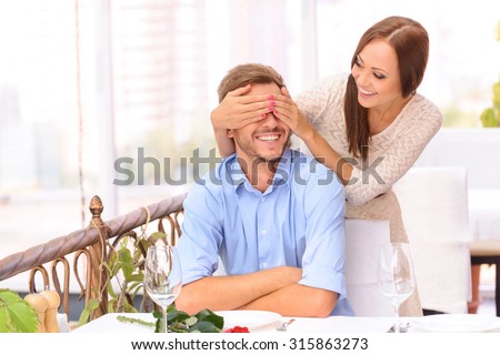 https://thumb10.shutterstock.com/display_pic_with_logo/2270597/315863273/stock-photo-ready-for-surprise-nice-charming-young-woman-closing-eyes-of-her-boyfriend-with-hands-and-relaxing-315863273.jpg