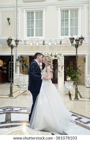 https://thumb10.shutterstock.com/display_pic_with_logo/2302709/381078103/stock-photo-wedding-couple-in-the-restaurant-is-dancing-beautiful-model-girl-in-white-dress-handsome-man-in-381078103.jpg