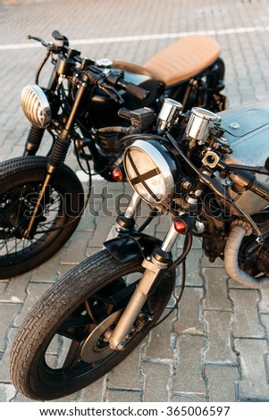 Two Vintage Custom Motorcycle Caferacer Motorbike One With Grill Headlight Another Tape Cross Over Optic