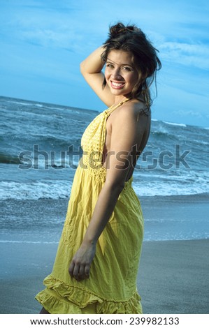 https://thumb10.shutterstock.com/display_pic_with_logo/2593219/239982133/stock-photo-a-cute-young-latina-girl-posing-in-a-yellow-dress-on-the-beach-239982133.jpg