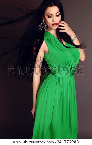 https://thumb10.shutterstock.com/display_pic_with_logo/2641528/241772983/stock-photo-fashion-photo-of-beautiful-woman-with-sexy-body-dark-long-hair-wearing-in-green-evening-dress-with-241772983.jpg