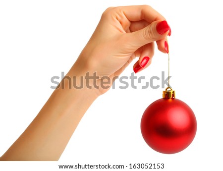 Hand holding christmas ball on white background - stock photo