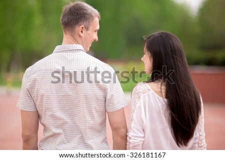https://thumb10.shutterstock.com/display_pic_with_logo/2780032/326181167/stock-photo-couple-of-lovers-attractive-young-man-and-woman-on-romantic-date-walking-holding-hands-in-park-326181167.jpg