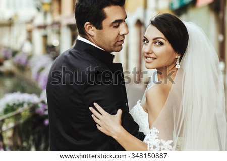 https://thumb10.shutterstock.com/display_pic_with_logo/2988610/348150887/stock-photo-gorgeous-beautiful-exotic-brunette-bride-and-handsome-groom-posing-closeup-348150887.jpg