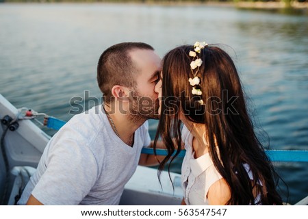https://thumb10.shutterstock.com/display_pic_with_logo/3026468/563547547/stock-photo-young-beautiful-married-couple-in-love-at-the-yacht-on-vacation-563547547.jpg
