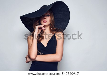 https://thumb10.shutterstock.com/display_pic_with_logo/339643/540740917/stock-photo-portrait-of-elegant-beautiful-woman-in-a-black-dress-and-wide-hat-isolated-on-white-background-in-540740917.jpg