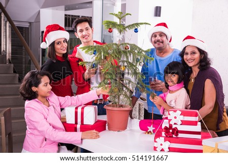 family christmas holidays and people concept happy indian kids decorating christmas tree - People Decorating A Christmas Tree family christmas holidays and people concept happy indian kids decorating christmas tree - People Decorating A Christmas Tree