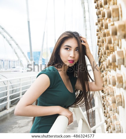 https://thumb10.shutterstock.com/display_pic_with_logo/360472/486324577/stock-photo-young-beautiful-asian-woman-standing-on-metal-bridge-cute-girl-look-at-far-away-female-have-long-486324577.jpg