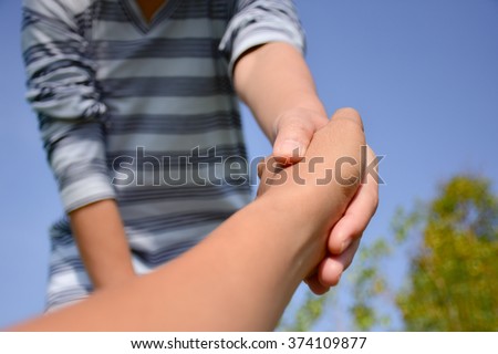 stock-photo-helping-hand-take-my-hand-to-hearten-you-374109877.jpg