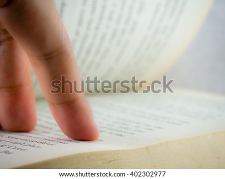 Reading Book Finger Pointing Out Words Stock Photo