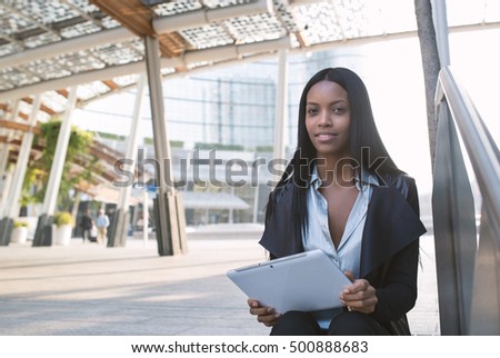 https://thumb10.shutterstock.com/display_pic_with_logo/438058/500888683/stock-photo-happy-young-mixed-race-latina-businesswoman-portrait-outdoors-in-milan-with-modern-building-as-500888683.jpg