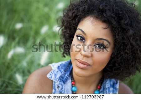 https://thumb10.shutterstock.com/display_pic_with_logo/463684/119703967/stock-photo-young-african-woman-relaxing-in-the-park-119703967.jpg