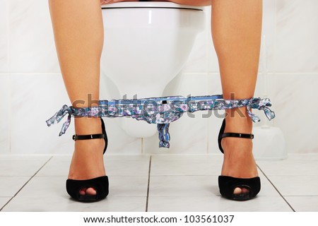 Photo Of Woman Sitting On A Toilet. - 62273683 : Shutterstock