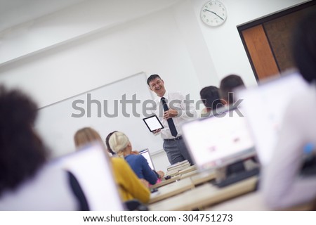 stock photo group of students with teacher in computer lab classrom learrning lessons get help and support 304751273