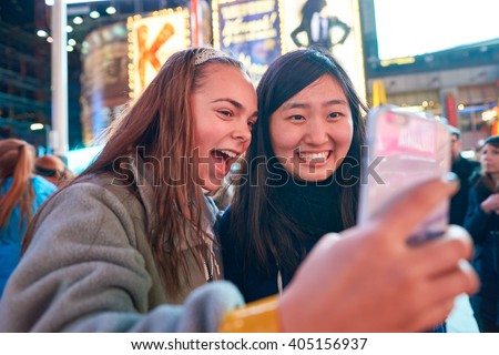 https://thumb10.shutterstock.com/display_pic_with_logo/54851/405156937/stock-photo-new-york-circa-march-women-taking-a-selfie-in-new-york-a-selfie-is-a-self-portrait-405156937.jpg