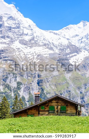 Swiss Mountain House beautiful swiss mountain valley landscape single stock photo Swiss Mountain House beautiful swiss mountain valley landscape single stock photo