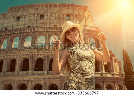 https://thumb10.shutterstock.com/display_pic_with_logo/58920/333666797/stock-photo-happiness-female-tourist-at-white-hat-on-the-beautiful-view-of-coliseum-in-rome-333666797.jpg