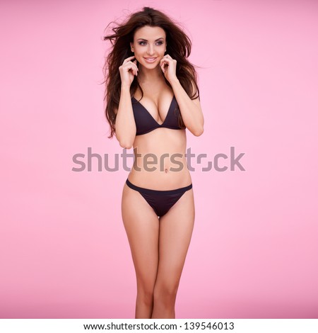 Busty Brunette In Pink Thong Bikini