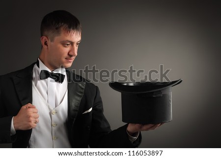 Magician Black Suit Holding Top Hat Stock Photo 67484410 - Shutterstock