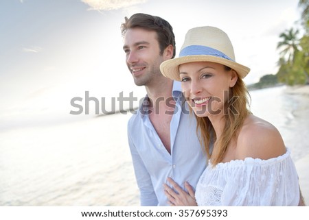 https://thumb10.shutterstock.com/display_pic_with_logo/624661/357695393/stock-photo-happy-just-married-couple-walking-on-a-sandy-beach-357695393.jpg