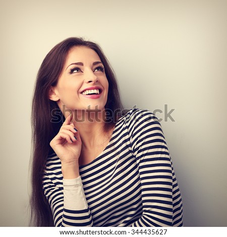 https://thumb10.shutterstock.com/display_pic_with_logo/640141/344435627/stock-photo-happy-emotional-woman-thinking-and-looking-up-with-toothy-smiling-vintage-portrait-344435627.jpg