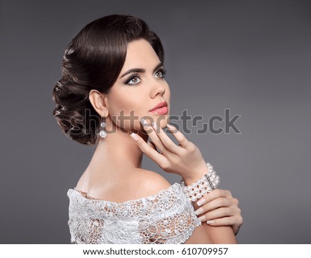 https://thumb10.shutterstock.com/display_pic_with_logo/662170/610709957/stock-photo-retro-woman-portrait-elegant-lady-with-hairstyle-pearls-jewelry-set-and-french-manicured-nails-610709957.jpg