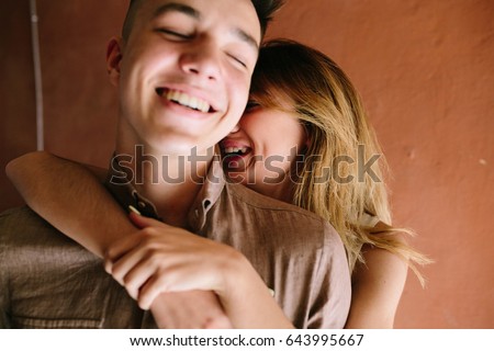 girl hugging guy from behind girl hugging guy from behind