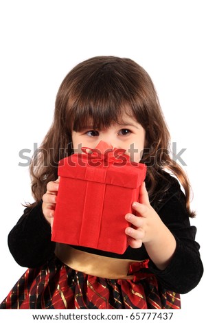 https://thumb10.shutterstock.com/display_pic_with_logo/6719/6719,1290551076,3/stock-photo-cute-three-year-old-little-girl-dressed-up-in-a-fancy-dress-hiding-behind-a-red-giftbox-on-a-white-65777437.jpg