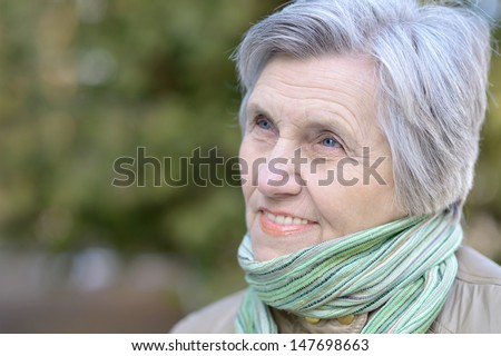 https://thumb10.shutterstock.com/display_pic_with_logo/674632/147698663/stock-photo-older-woman-enjoying-a-walk-on-the-nature-of-the-spring-147698663.jpg