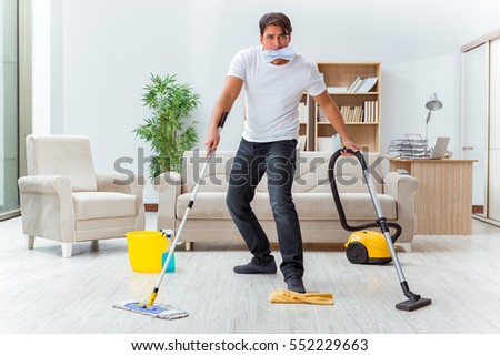 Cleaning The House man husband cleaning house helping wife stock photo 582226093 Cleaning The House man husband cleaning house helping wife stock photo 582226093