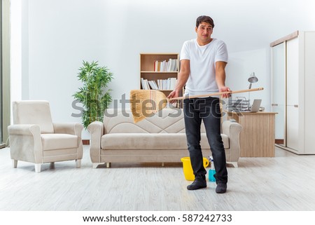 Cleaning The House man husband cleaning house helping wife stock photo 582226093 Cleaning The House man husband cleaning house helping wife stock photo 582226093