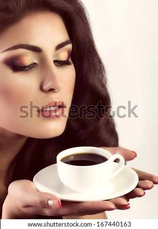 https://thumb10.shutterstock.com/display_pic_with_logo/694276/167440163/stock-photo-beautiful-woman-with-coffee-cup-fashion-portrait-167440163.jpg