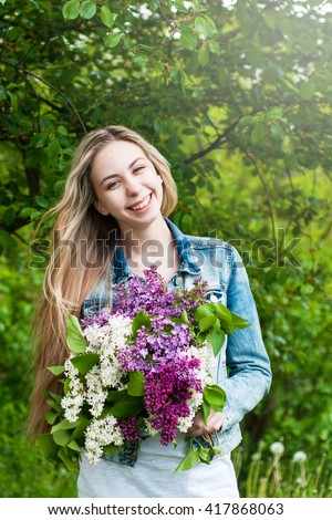 http://thumb10.shutterstock.com/display_pic_with_logo/696043/417868063/stock-photo-girl-with-a-bouquet-of-lilac-flowers-417868063.jpg