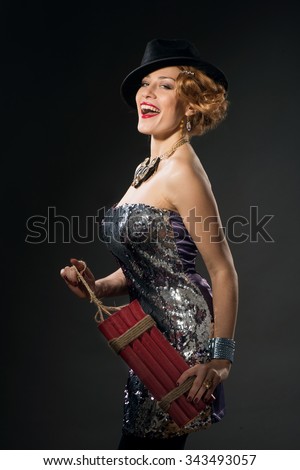 https://thumb10.shutterstock.com/display_pic_with_logo/70102/343493057/stock-photo-beautiful-woman-in-vintage-style-dress-and-hat-holding-dynamite-on-dark-studio-background-343493057.jpg