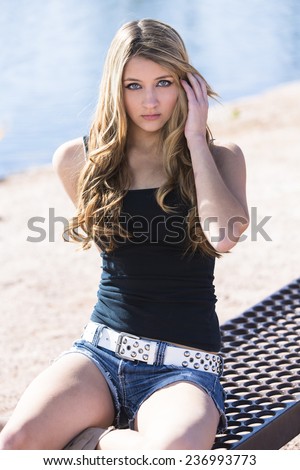 stock photo beautiful teen girl with long blonde hair sitting and posing wearing denim shorts and white belt 236993773 - Hard anodized cookware Women Make the perfect Wife Direct For Committed Men Searching for00 a Good Partner