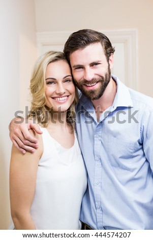 https://thumb10.shutterstock.com/display_pic_with_logo/76219/444574207/stock-photo-happy-couple-standing-with-arm-around-at-home-444574207.jpg