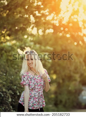 https://thumb10.shutterstock.com/display_pic_with_logo/785125/205182733/stock-photo-spring-woman-in-summer-dress-walking-in-green-park-enjoying-the-sun-205182733.jpg