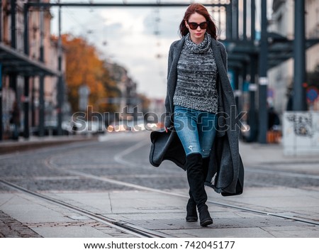https://thumb10.shutterstock.com/display_pic_with_logo/787438/742045177/stock-photo-trendy-fashion-woman-in-coat-walking-on-the-street-urban-city-scene-742045177.jpg