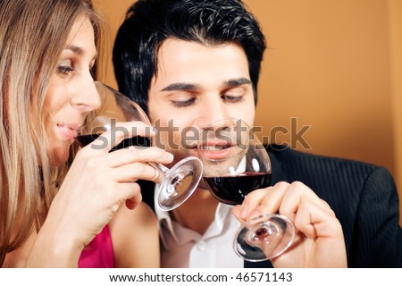 https://thumb10.shutterstock.com/display_pic_with_logo/84610/84610,1266067107,3/stock-photo-young-couple-man-and-woman-in-a-restaurant-drinking-glasses-of-red-wine-focus-on-the-face-of-46571143.jpg