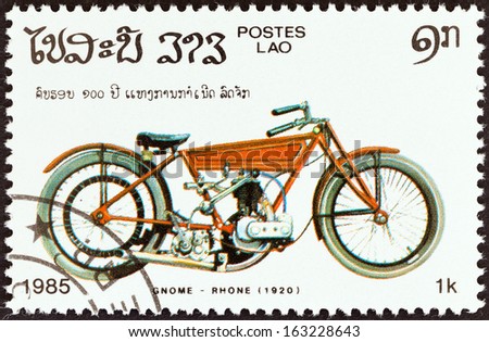 Juego con regalo de lotes de sellos - Página 7 Stock-photo-laos-circa-a-stamp-printed-in-laos-from-the-centenary-of-motorcycle-issue-shows-a-gnome-163228643