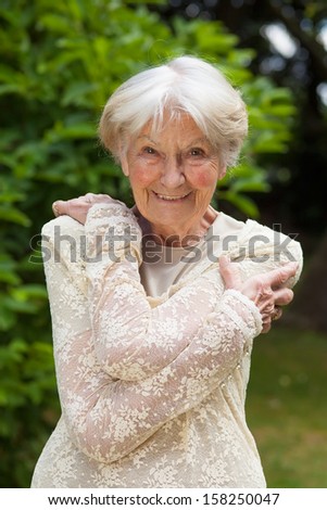 Asian Symbols of Marriage stock photo attractive friendly elderly lady attractive friendly elderly lady with a lovely smile posing 158250047