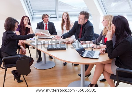 stock-photo-seven-people-having-a-business-meeting-in-the-conference-room-55855501.jpg