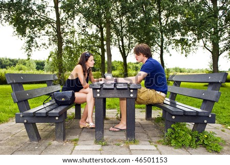 https://thumb10.shutterstock.com/display_pic_with_logo/94199/94199,1265967777,33/stock-photo-young-couple-at-a-picnic-table-talking-and-making-travel-plans-46501153.jpg