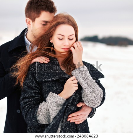 https://thumb10.shutterstock.com/display_pic_with_logo/952708/248084623/stock-photo-outdoor-fashion-sensual-portrait-of-young-beautiful-happy-stylish-couple-in-love-standing-in-cold-248084623.jpg