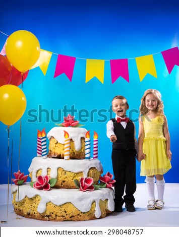Image result for pic of a little boy and a little girl with a huge birthday cake