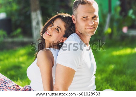 https://thumb10.shutterstock.com/display_pic_with_logo/955855/601028933/stock-photo-beautiful-cute-couple-in-love-sitting-on-a-picnic-blanket-outdoor-caucasian-happy-man-and-smiling-601028933.jpg