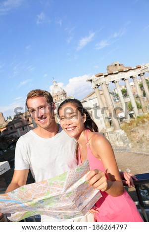 stock photo tourists holding map by roman forum sightseeing on travel vacation in rome italy happy tourist 186264797