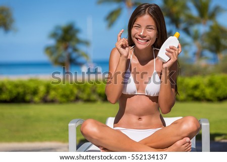 http://thumb10.shutterstock.com/display_pic_with_logo/97565/552134137/stock-photo-happy-cute-asian-girl-putting-sunscreen-lotion-on-body-showing-suntan-bottle-in-summer-resort-at-552134137.jpg