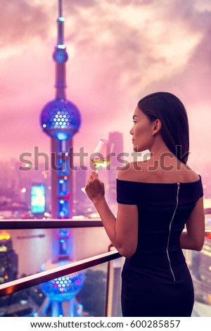 https://thumb10.shutterstock.com/display_pic_with_logo/97565/600285857/stock-photo-elegant-asian-woman-in-gown-drinking-white-wine-glass-at-rooftop-bar-terrace-looking-at-city-lights-600285857.jpg